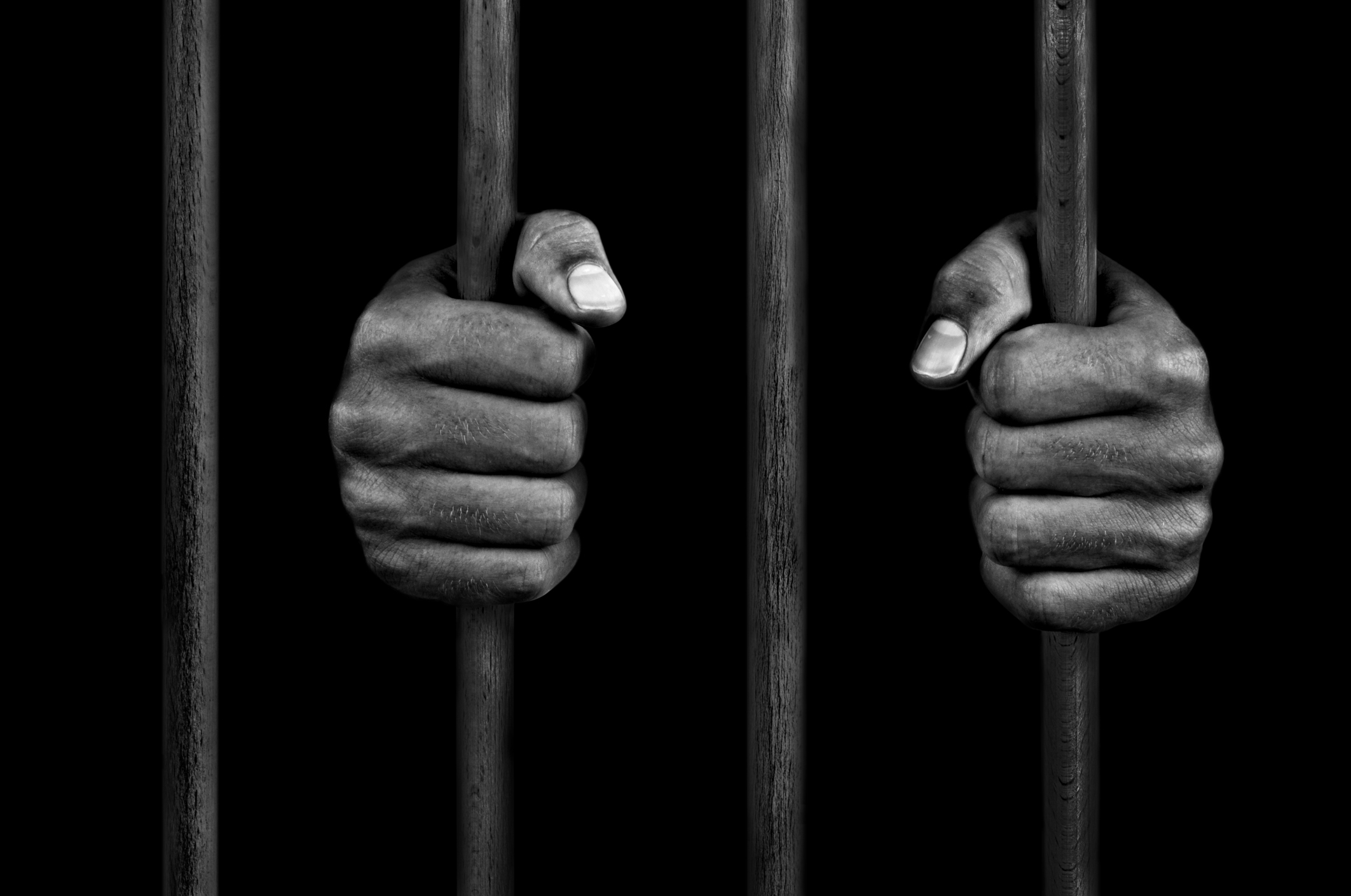James forman jr hands of a prisoner on prison bars